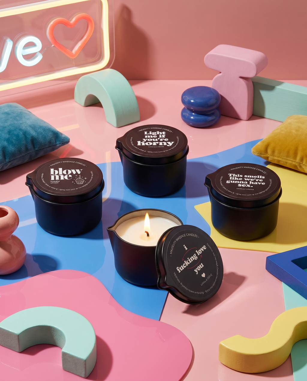 Candle with black lid on a colorful surface with decorative elements