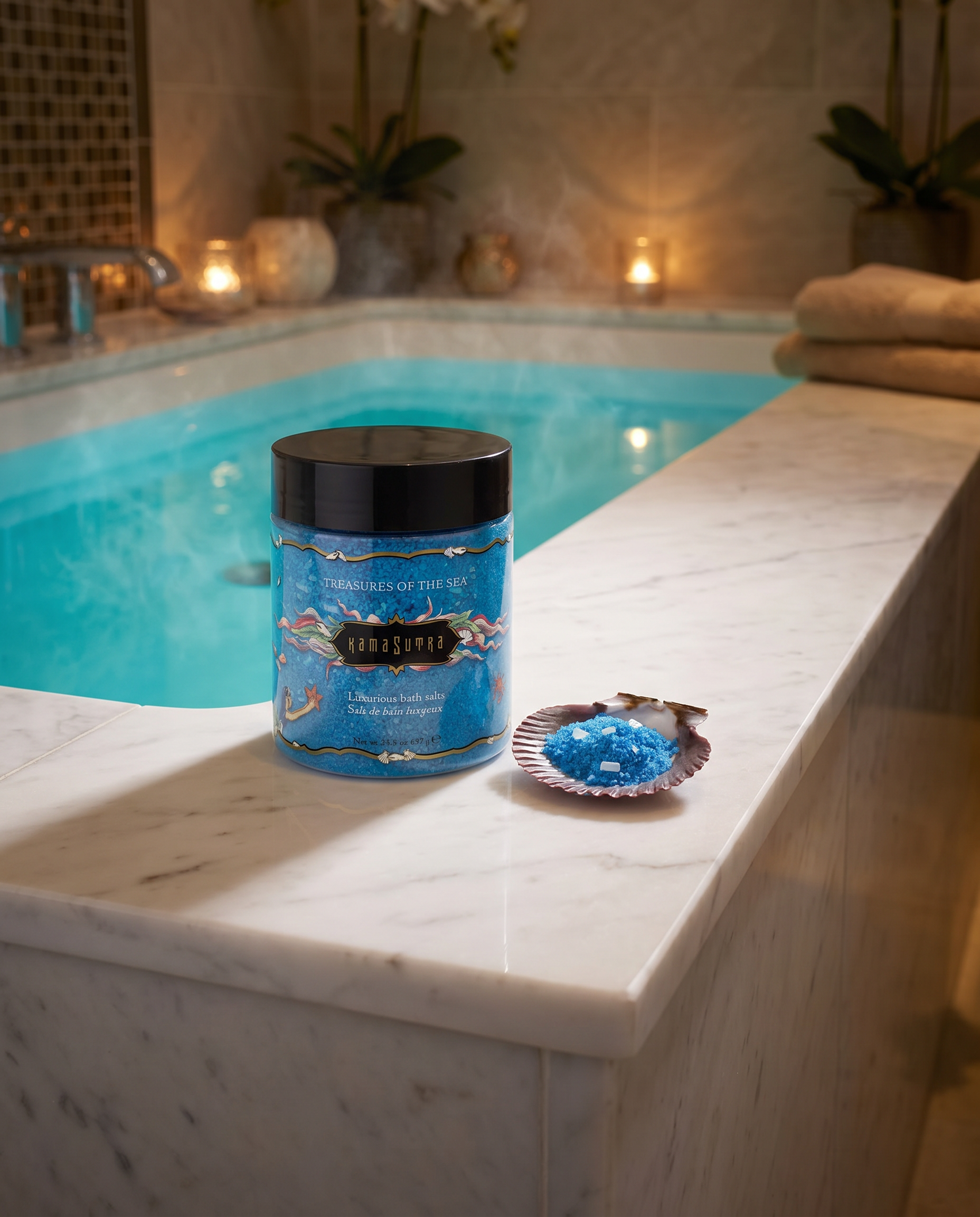 Jar of bath salts with a shell of blue crystals on a marble ledge by a pool.