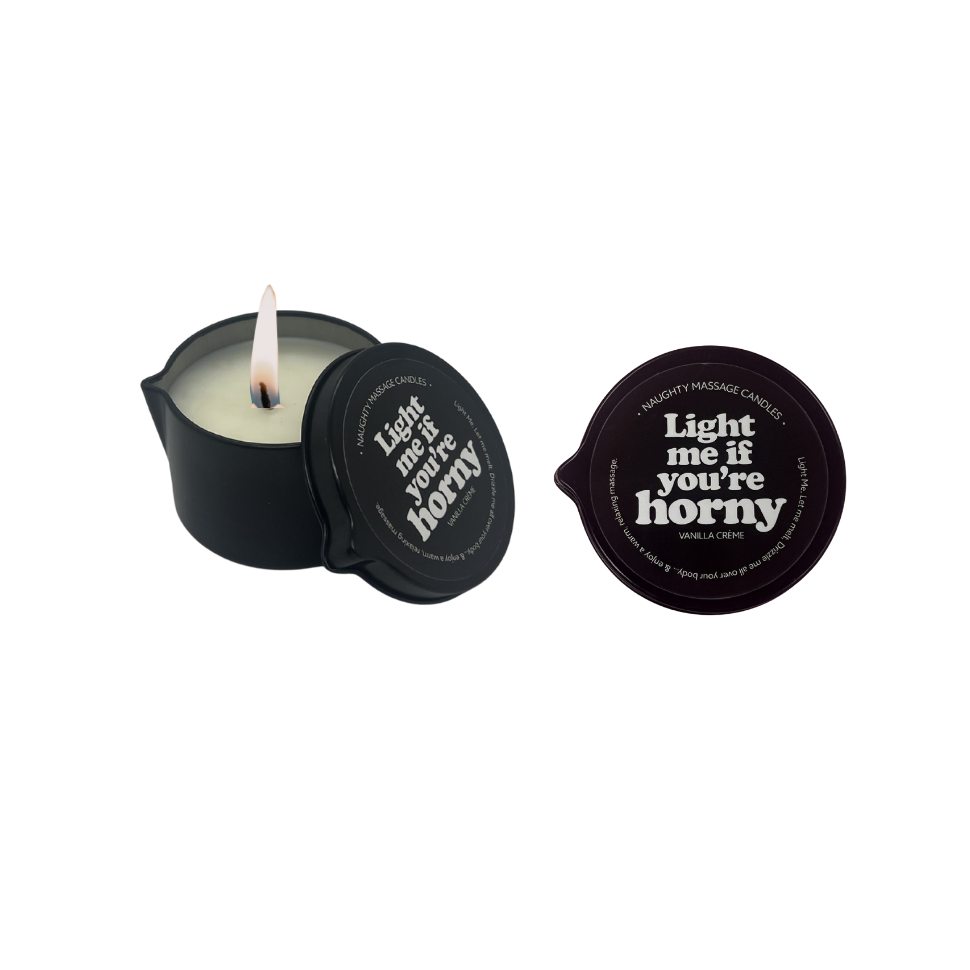 Candle in a black container with a lid featuring text on a white background