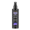 Black spray bottle labeled  Kama Sutra Sex Magnet Blue Lotus on a white background
