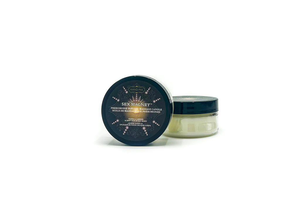 a photo of SEX MAGNET  massage candle in a clear container with black lid in vanilla amber scent in 1.7oz size