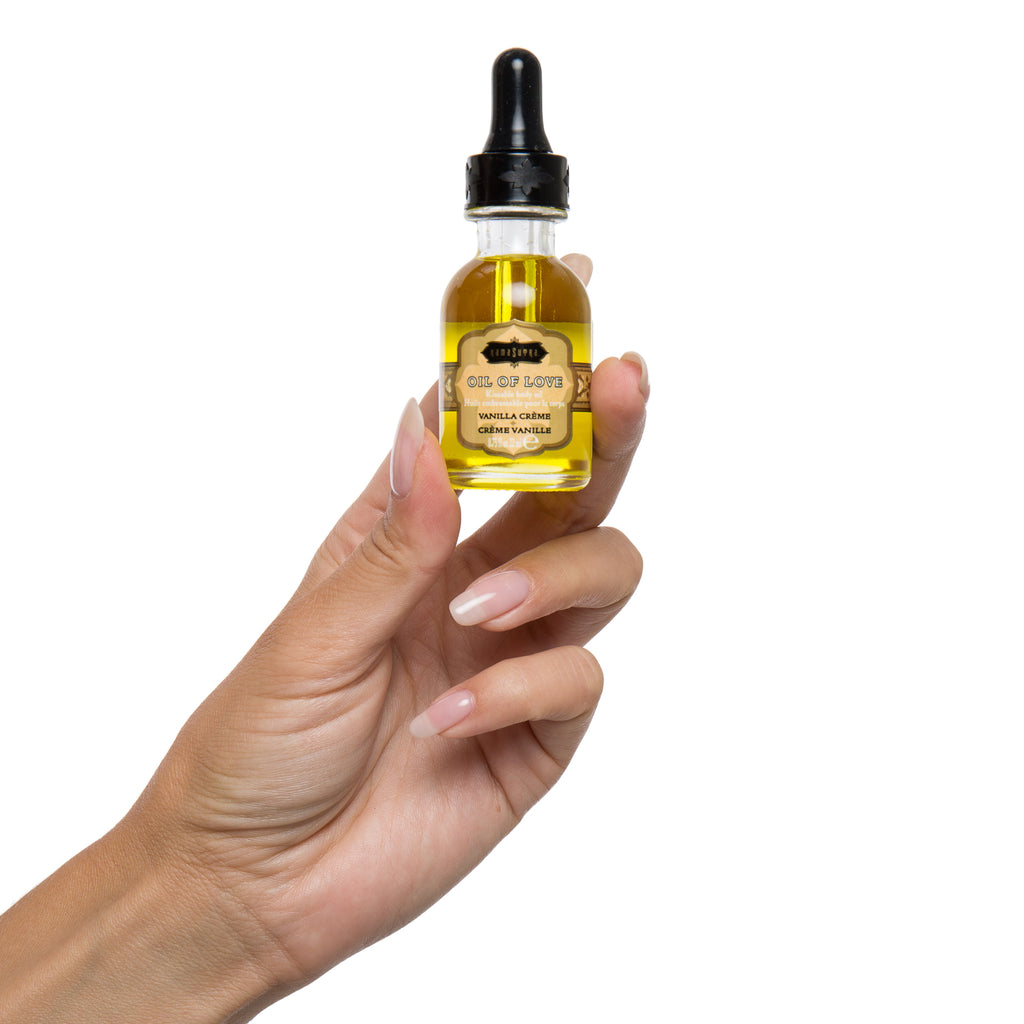 photo of Oil of Love vanilla  in models hand