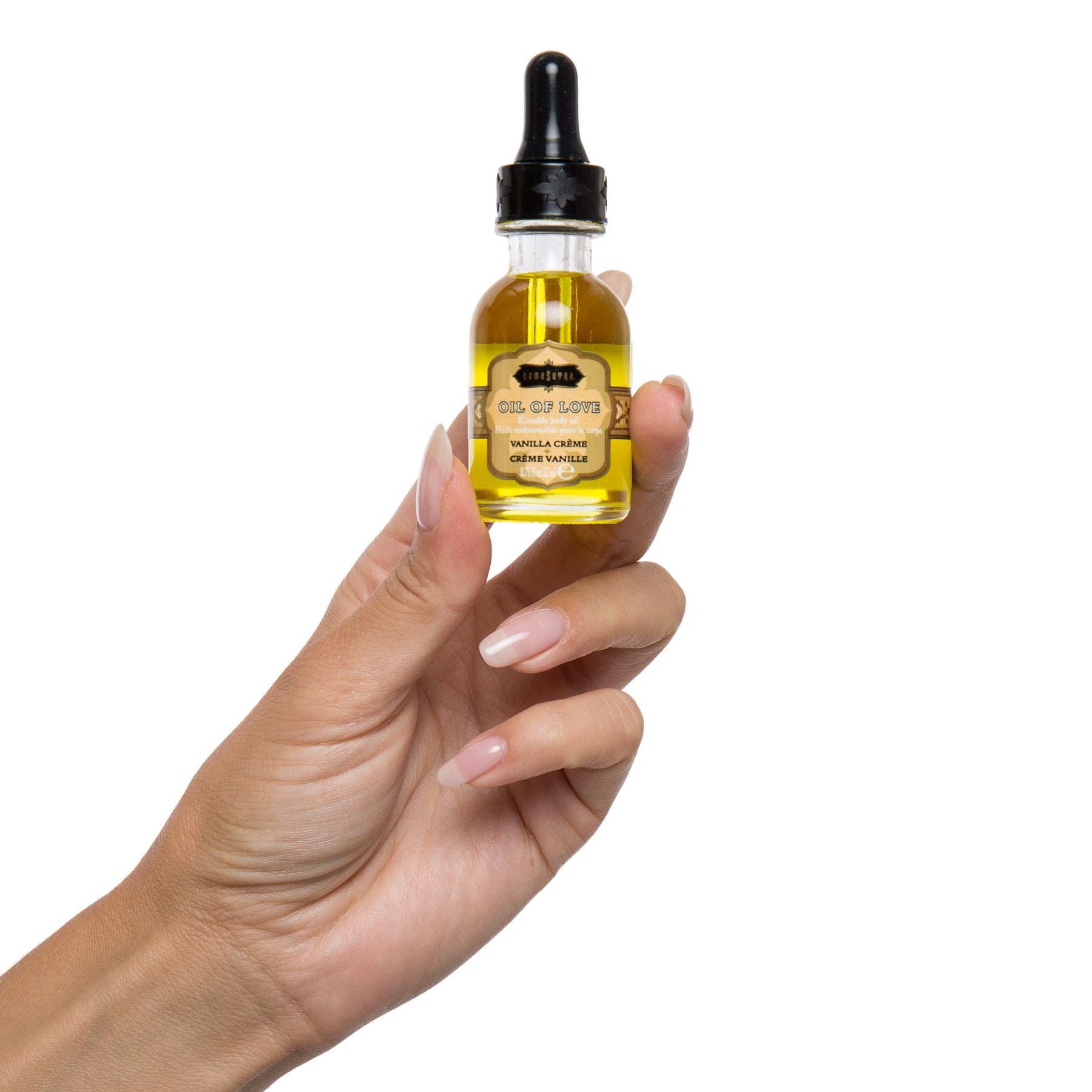 photo of Oil of Love vanilla  in models hand