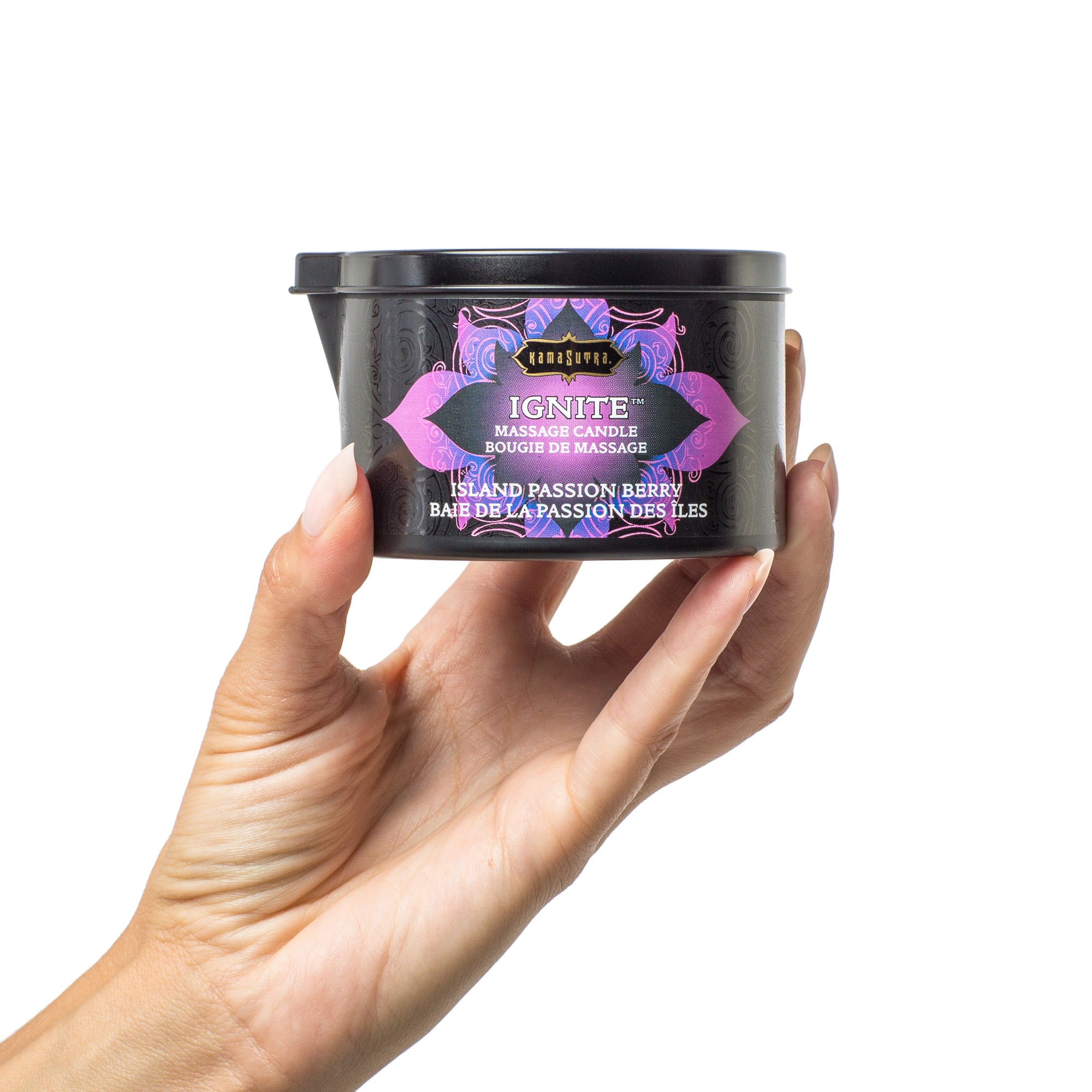 Ignite Massage Oil Candle Island Passion Berry in Models hand- The Kama Sutra Company 