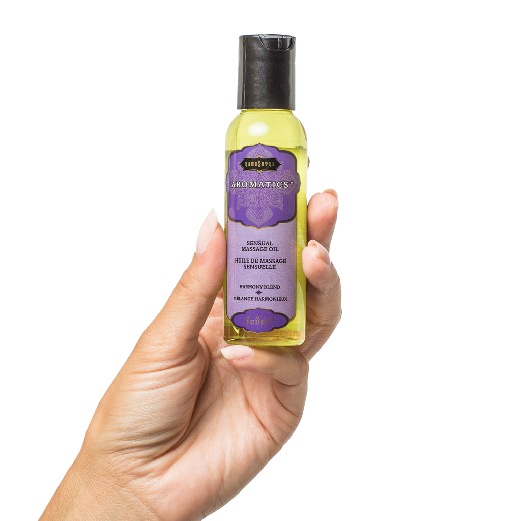 Aromatics Massage Oil (2oz) Harmony Blend shown in models hand- The Kama Sutra Company