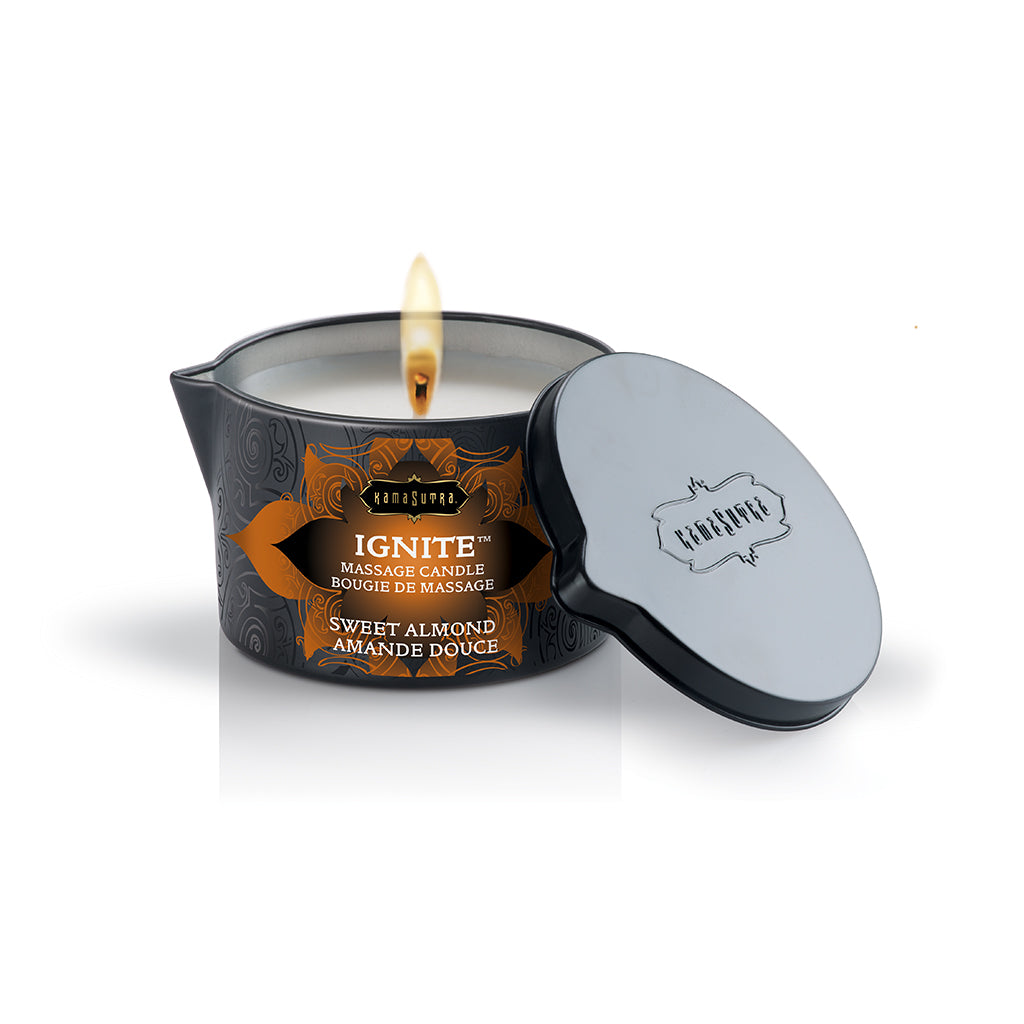 Ignite Massage Oil Candle sweet almond lit with lid off - The Kama Sutra Company