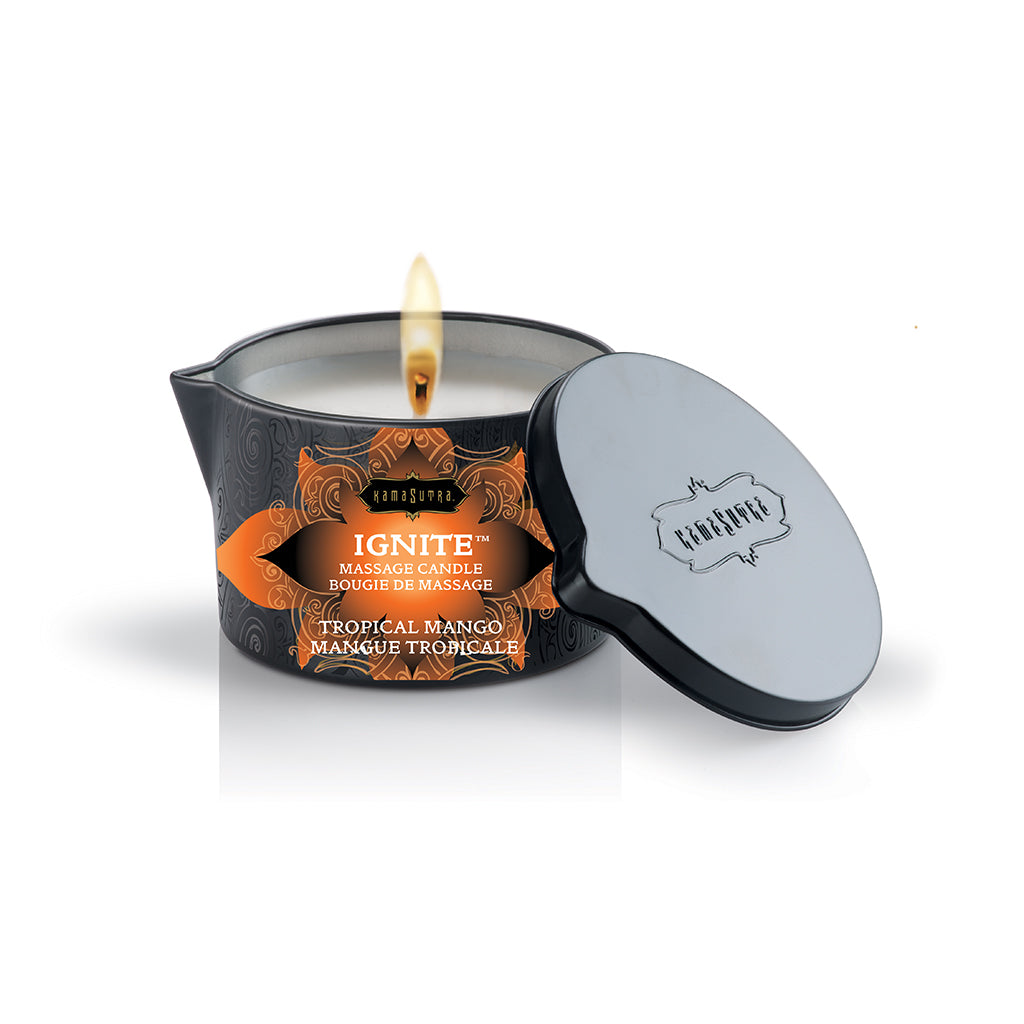 Ignite Massage Oil Candle tropical mango with lid off and candle lit - The Kama Sutra Company